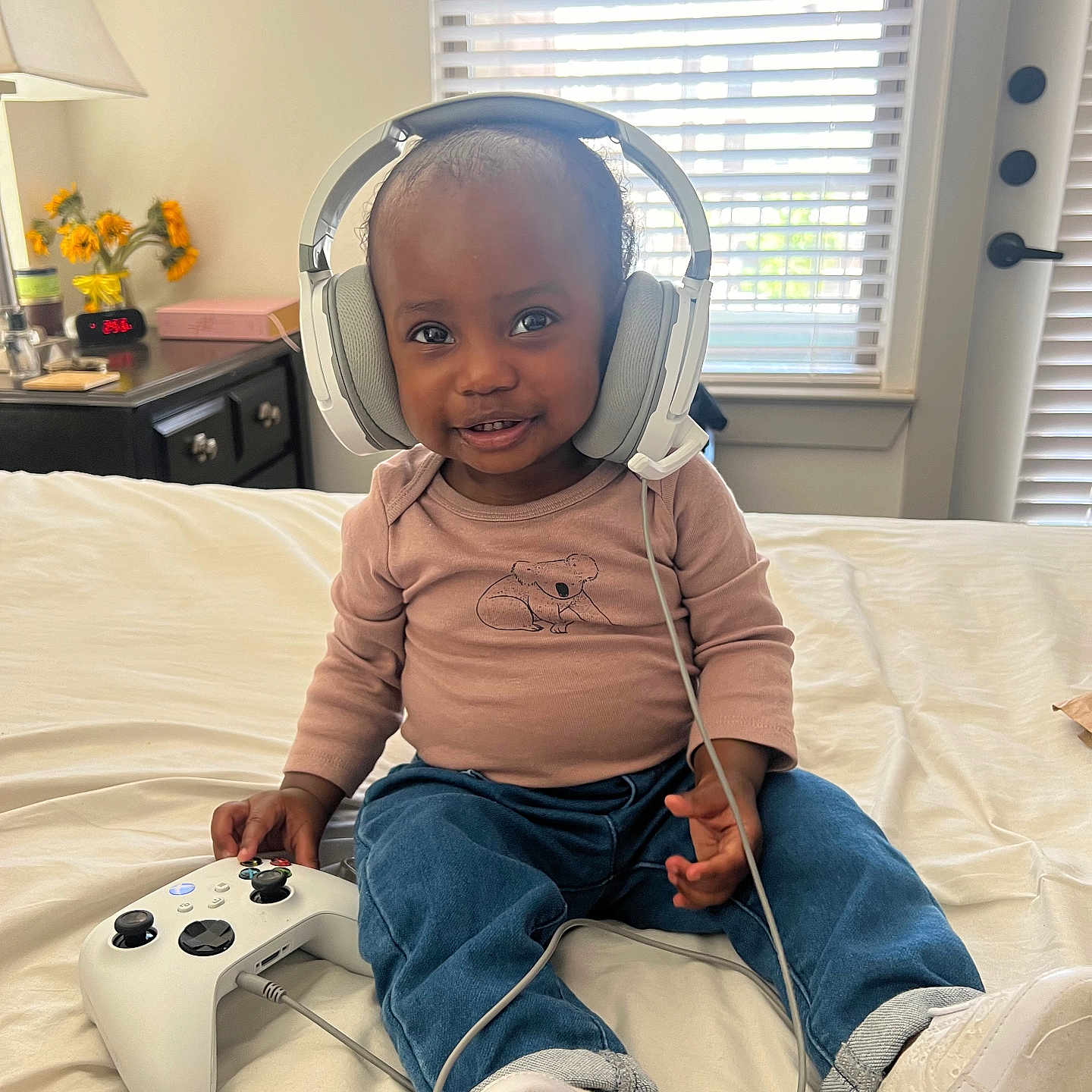 Luna joined the competition — help win amazing prizes! baby, bed, bedroom, book, clothing, couch, cushion, electronics, face, furniture, head, headphones, homedecor, pants, person, photography, portrait, publication, sitting, videogaming