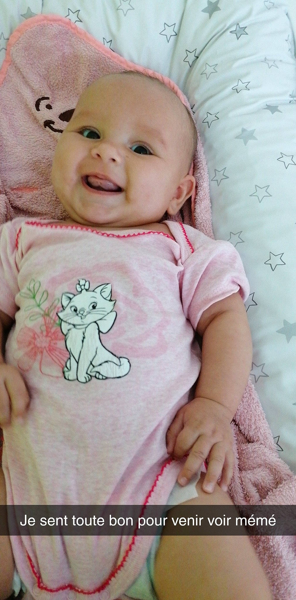 Nina participe au concours pour gagner de l'argent avec cette photo : arm, baby, baby_toddler_clothing, cheek, chin, eye, face, facial_expression, happy, iris, lip, neck, person, photograph, pink, product, skin, sleeve, smile, textile