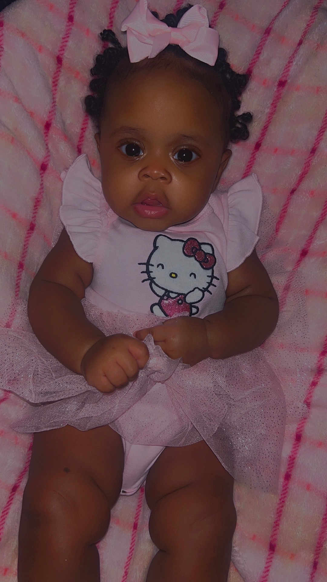 Onaraya is registered to the contest to win money with this photo: baby, infant, child, pink, hello_kitty, bow, curly_hair, blanket, tutu, dress, cute, portrait, chubby_arms, chubby_legs, soft_texture, indoors, clothing, person, smiling, hand
