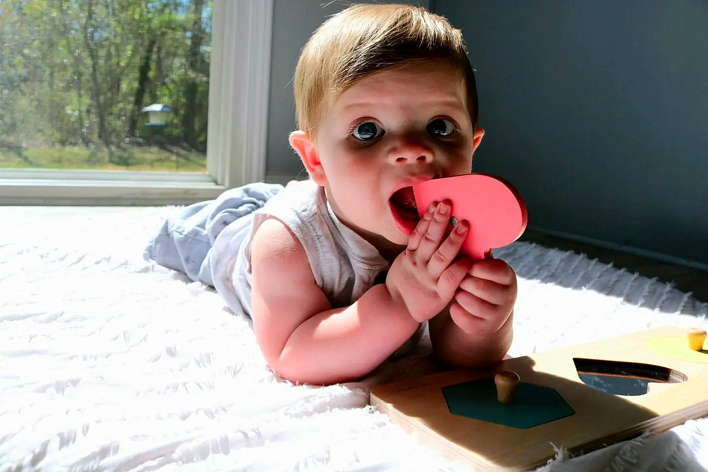 Barrett is registered to the contest to win money with this photo: audio_equipment, baby, baby_toddler_clothing, carmine, eyelash, finger, fun, happy, lip, mouth, nail, nose, person, plant, play, room, sitting, skin, thumb, toddler