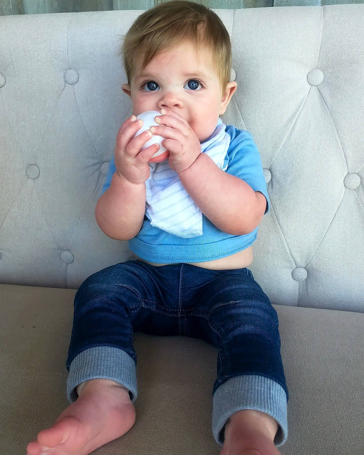 Barrett is registered to the contest to win money with this photo: baby_toddler_clothing, blue, cheek, eye, finger, gesture, hand, head, human_body, iris, joint, leg, mouth, neck, nose, organ, person, photograph, skin, sleeve