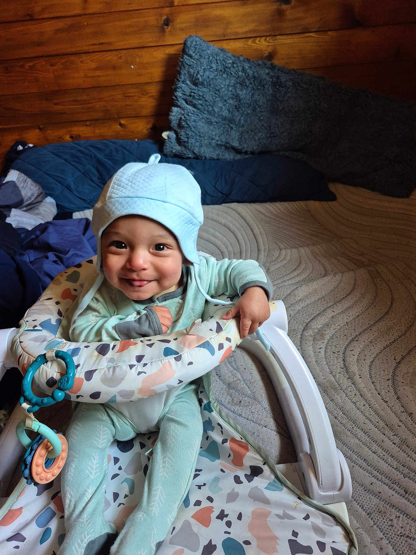 Jiraiya joined the competition — help win amazing prizes! baby, child, smiling, hat, baby_walker, indoor, wooden_wall, cushion, playful, happy, clothing, toy, seat, person, infant, cute, floor, fabric, comfortable, portrait