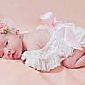 baby, newborn, infant, headband, flower, pink_bow, lace_clothing, soft_background, sleepy, cute, peaceful, portrait, lying_down, skin, closeup, child, adorable, baby_girl, soft_texture, delicate