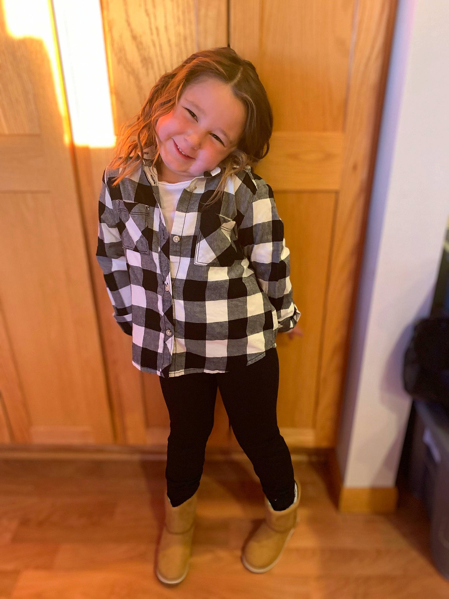 Bristol joined the competition — help win amazing prizes! baby_toddler_clothing, collar, dress_shirt, floor, flooring, hardwood, human_leg, joy, knee, long_hair, pattern, person, plaid, sleeve, smile, sportswear, standing, tartan, thigh, toddler