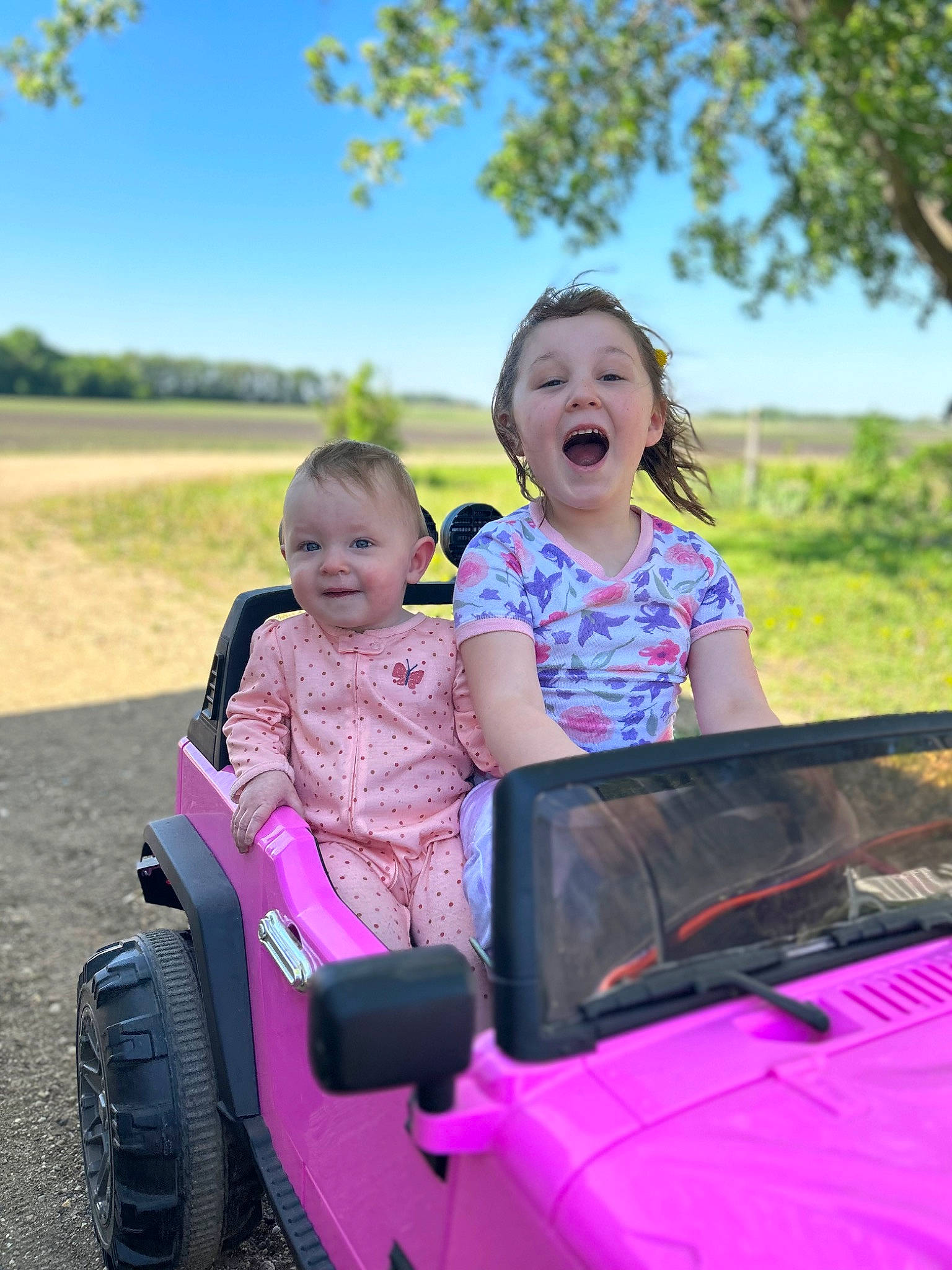 Oaklynn joined the competition — help win amazing prizes! automotive_design, automotive_exterior, automotive_tire, bumper, car, grass, happy, hood, joy, leisure, motor_vehicle, person, pink, plant, sky, smile, summer, tire, toddler, travel