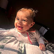 Jazzlyn joined the competition — help win amazing prizes! baby, babylaughing, bodypart, clothing, couch, face, finger, footwear, furniture, hand, happy, head, mouth, newborn, person, photography, portrait, shoe, sitting, smile