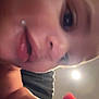 baby, close_up, face, hand, curious, indoor, skin, expression, child, young, person, light, blur, mouth, nose, eye, cheek, fingertip, background, focus
