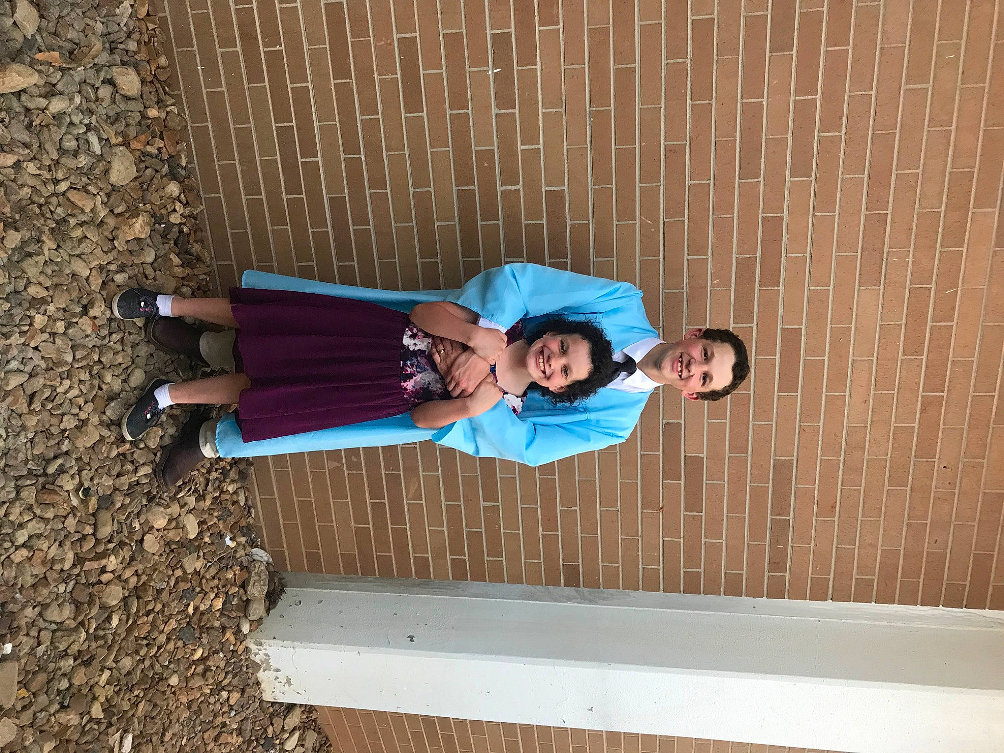 Emily joined the competition — help win amazing prizes! brick, brickwork, concrete, electric_blue, fun, human_leg, joy, leisure, pattern, person, shadow, smile, street_fashion, t_shirt, thigh, waist, walking_shoe, wood, wrist