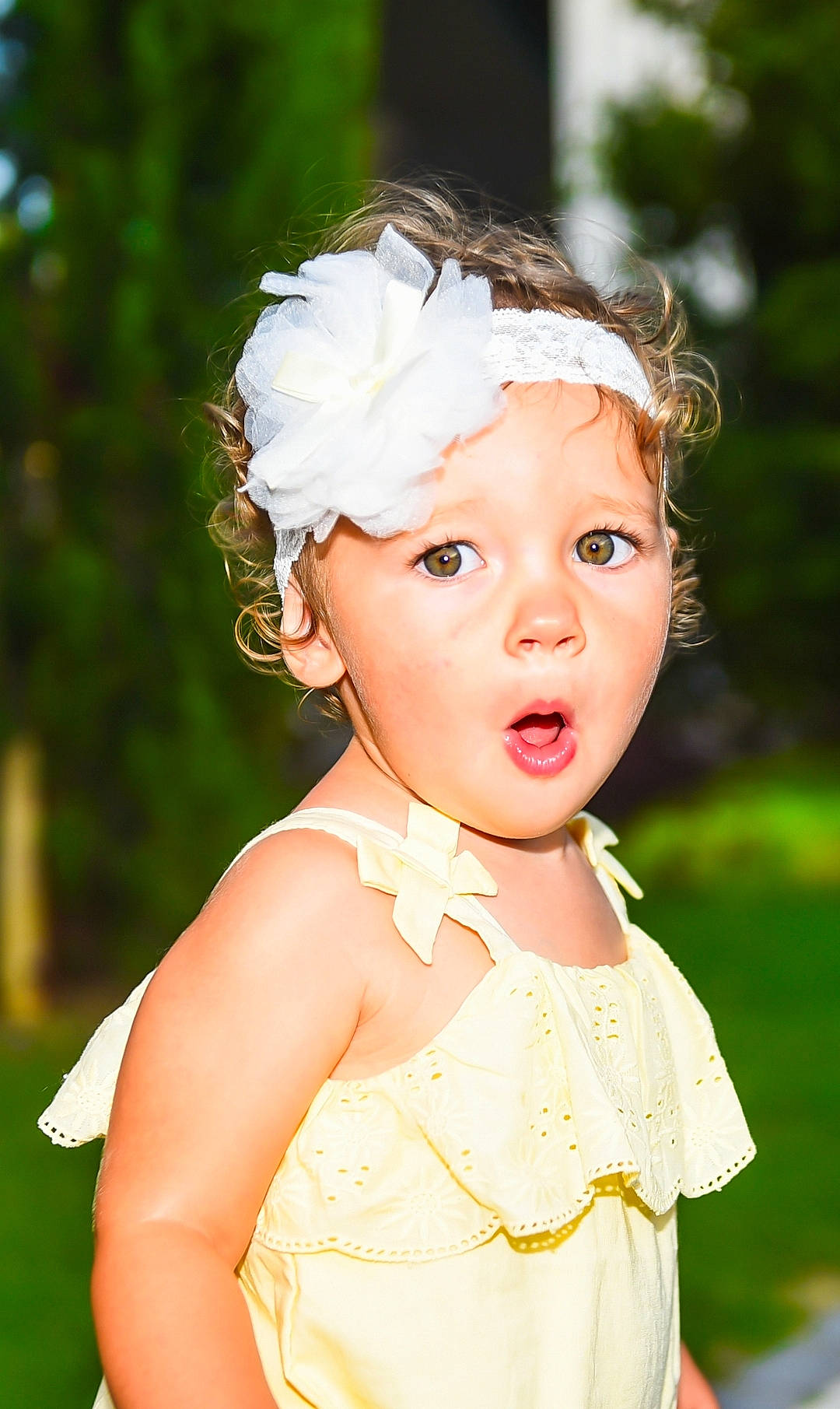 Kora is registered to the contest to win money with this photo: baby_toddler_clothing, blond, bridal_accessory, day_dress, dress, embellishment, eyelash, flash_photography, gown, grass, hair, happy, head, headpiece, headwear, iris, jewellery, lip, person, pink