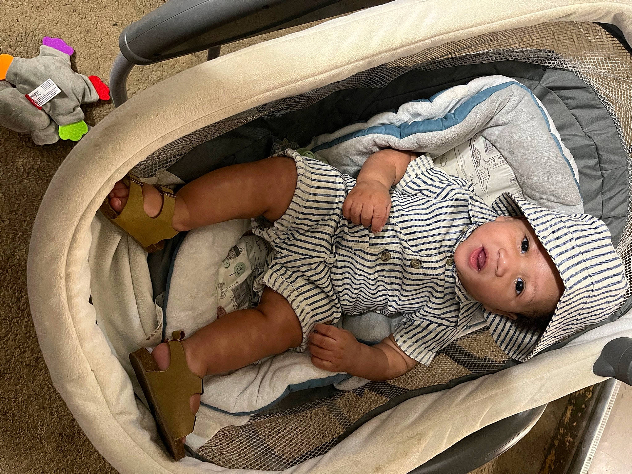 Canaan is registered to the contest to win money with this photo: baby, baby_products, baby_safety, baby_sleeping, baby_toddler_clothing, bedtime, child, circle, comfort, family_car, foot, headwear, human_leg, infant_bed, linens, nap, person, product, sandal, sleep