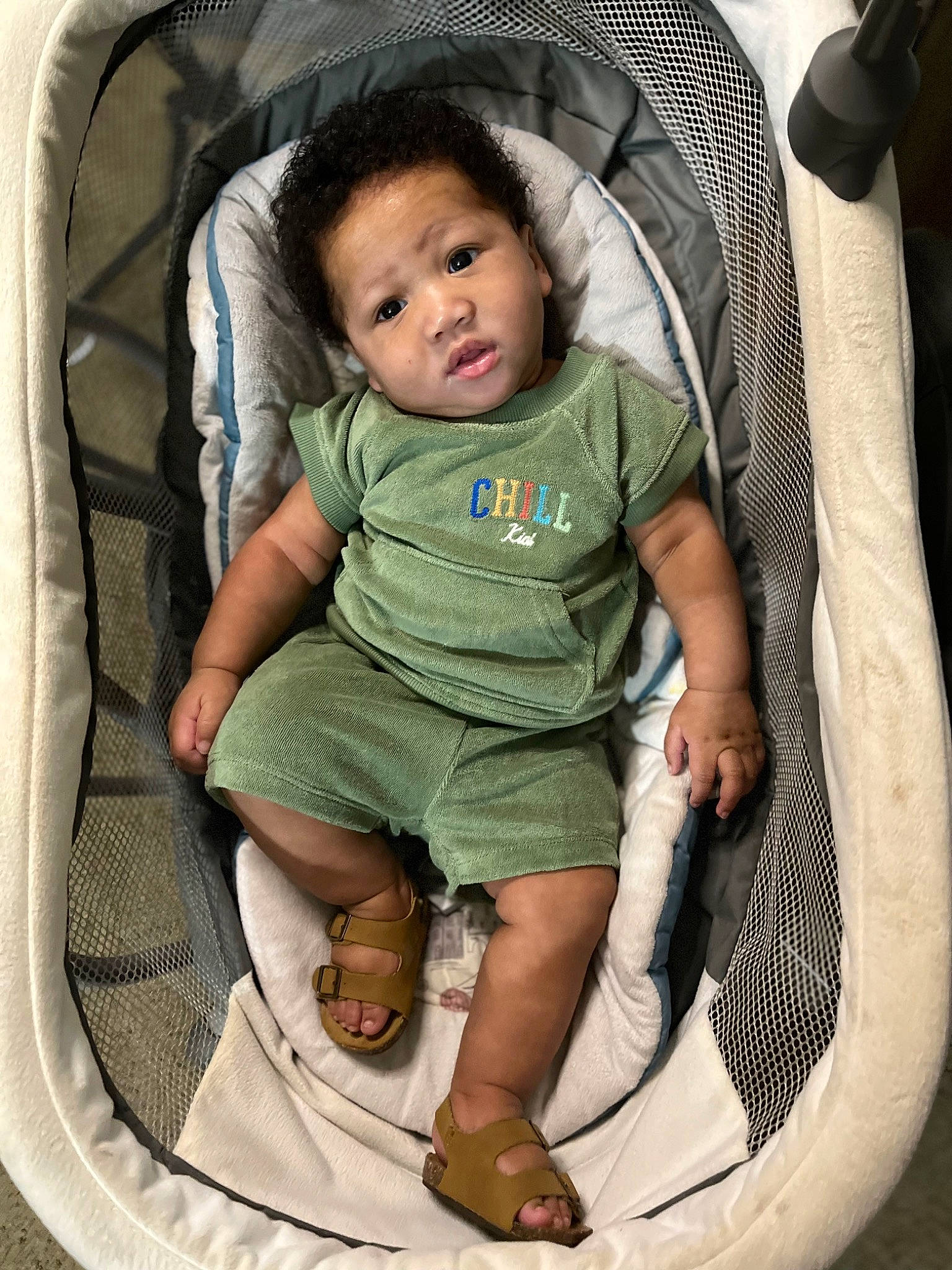 Canaan is registered to the contest to win money with this photo: auto_part, baby, baby_carriage, baby_products, baby_toddler_clothing, bag, car_seat, chair, child, circle, comfort, family_car, fun, hairstyle, head, mouth, person, product, sandal, sitting