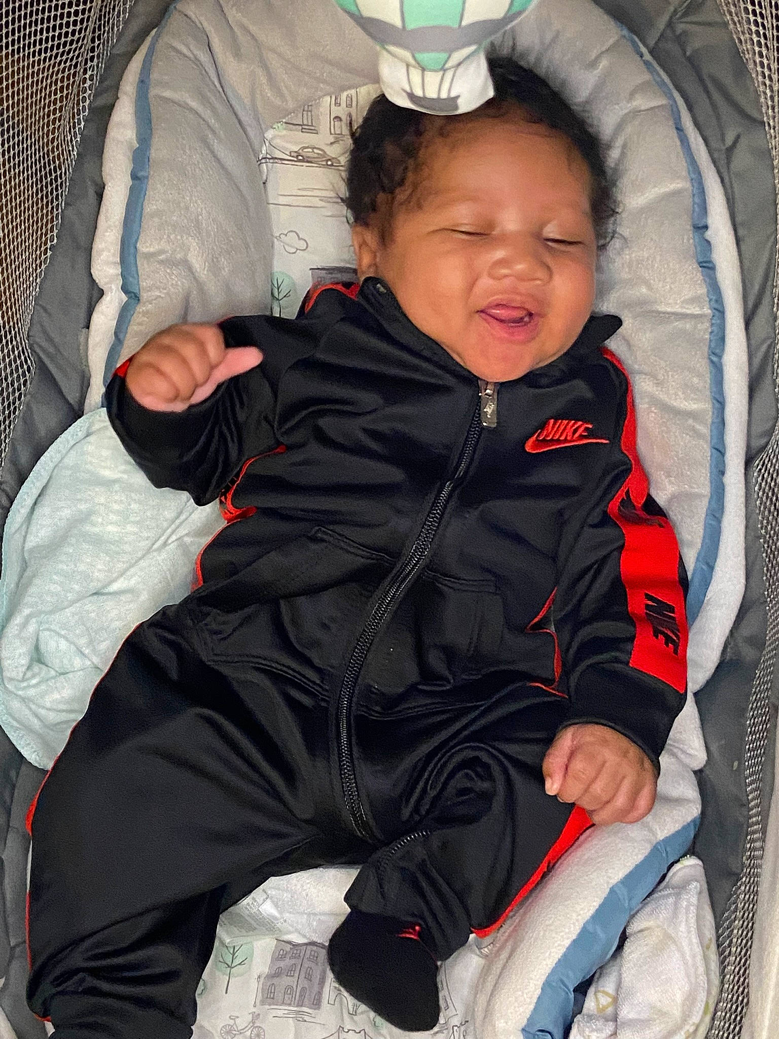 Canaan is registered to the contest to win money with this photo: baby, baby_carriage, baby_in_car_seat, baby_products, baby_safety, baby_toddler_clothing, cheek, child, comfort, cool, face, fun, happy, mouth, person, sitting, skin, sleeve, toddler, white