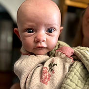 Trinity joined the competition — help win amazing prizes! baby, blanket, child, close_up, clothing, cozy, eyes, face, head, home, indoor, infant, looking_at_camera, person, photography, portrait, soft_focus, swaddle, warm_lighting, wide_eyed