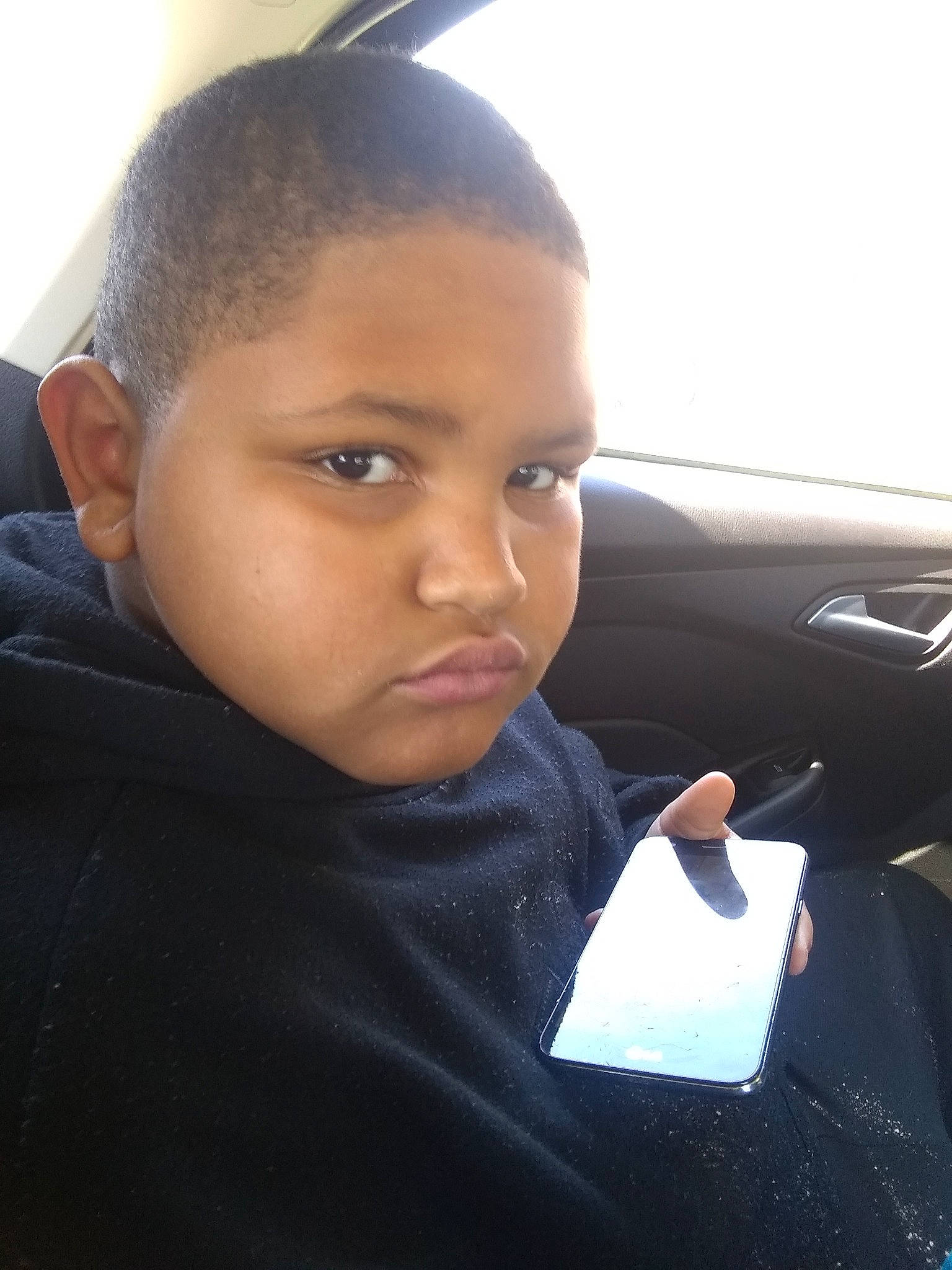 Kymani joined the competition — help win amazing prizes! automotive_window_part, black_hair, buzz_cut, cheek, child, face, family_car, forehead, hairstyle, nose, person