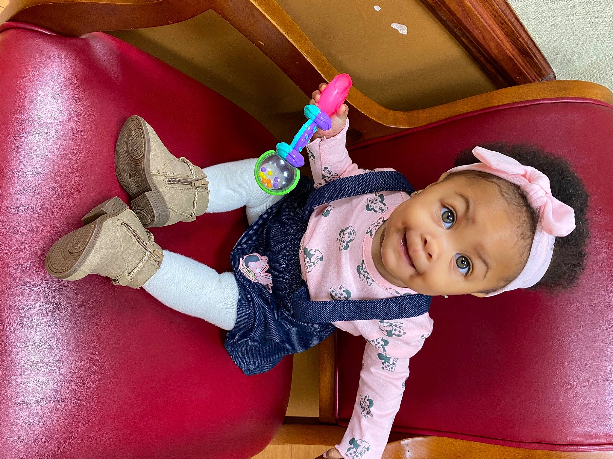 Erin is registered to the contest to win money with this photo: baby, baby_laughing, baby_toddler_clothing, baby_toys, fictional_character, glove, person, sock, toy, wrist