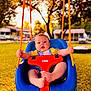baby, child, swing, playground, outdoor, sunset, orange_rope, blue_swing, red_safety_bar, grass, trees, daylight, infant, person, seat, fun, cute, nature, summer, play