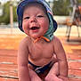 baby, child, hat, smiling, happy, sitting, outdoor, wooden_deck, sun_hat, bare_chest, infant, cute, summer, nature, portrait, daylight, skin, feet, hands, playful
