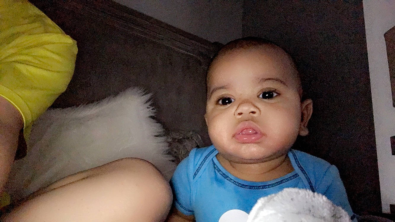 Mikel is registered to the contest to win money with this photo: baby, baby_products, baby_toddler_clothing, cheek, eyebrow, eyelash, human, iris, person, plush, skin, stuffed_toy, toy