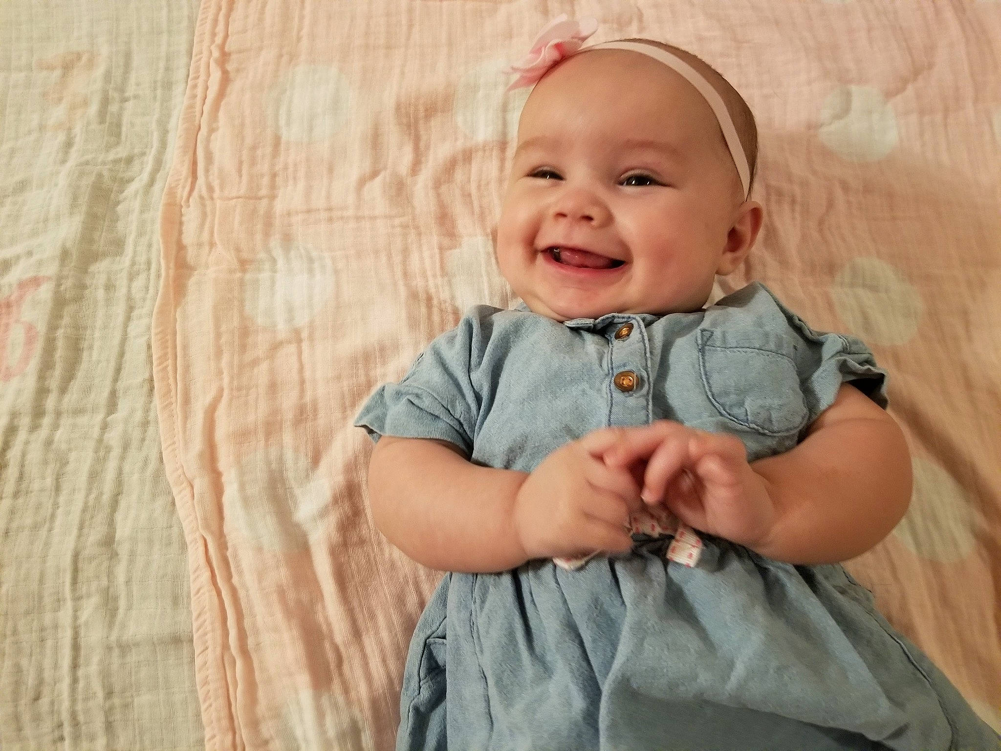 Delia is registered to the contest to win money with this photo: arm, baby, baby_laughing, cheek, child, face, facial_expression, finger, hand, happy, head, human, joy, laugh, mouth, nose, person, portrait, product, skin