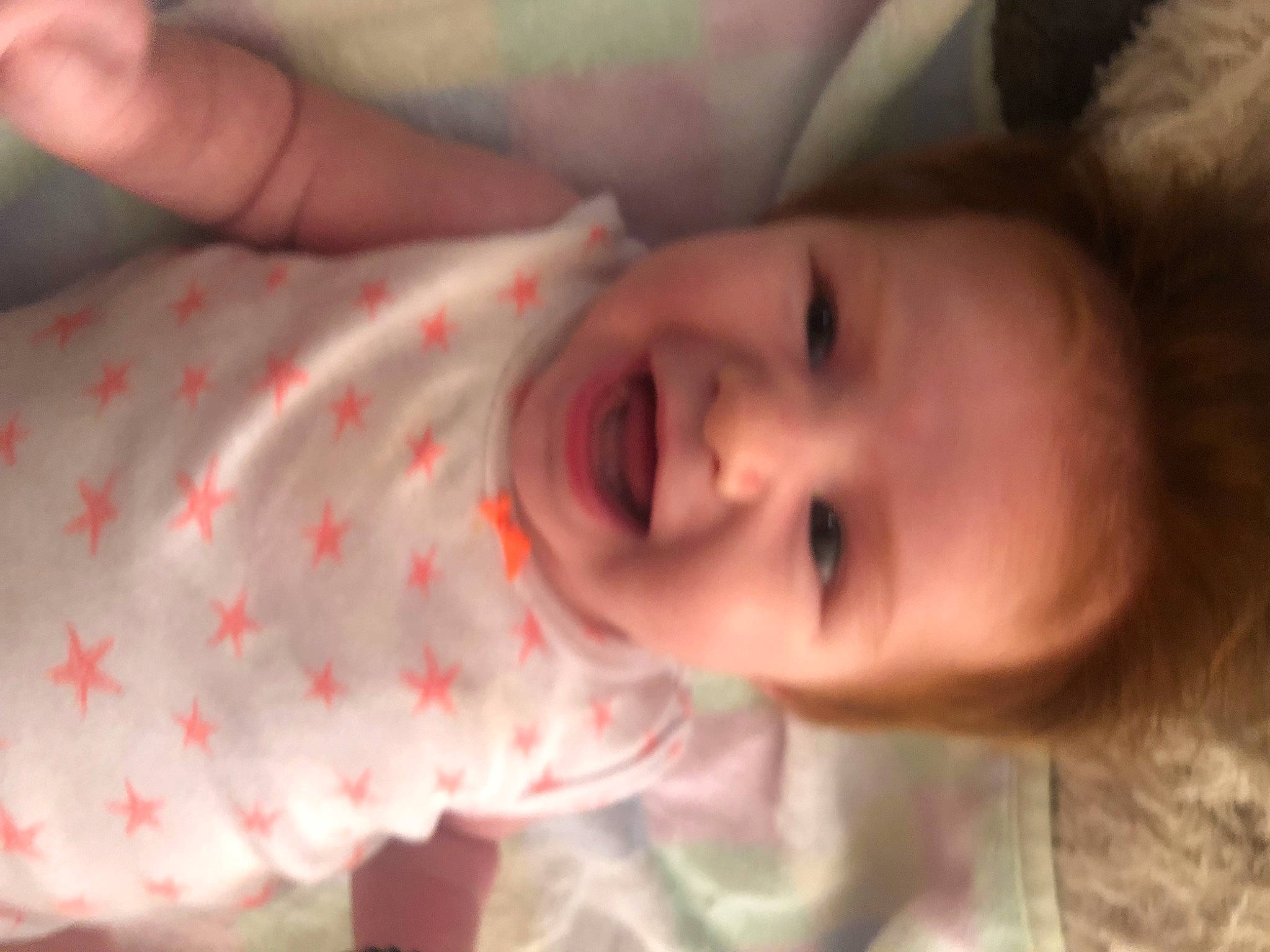 Aviana is registered to the contest to win money with this photo: baby, baby_toddler_clothing, cheek, eye, eyebrow, face, finger, happy, head, human, iris, lip, mouth, nose, organ, person, skin, sleeve, smile, textile