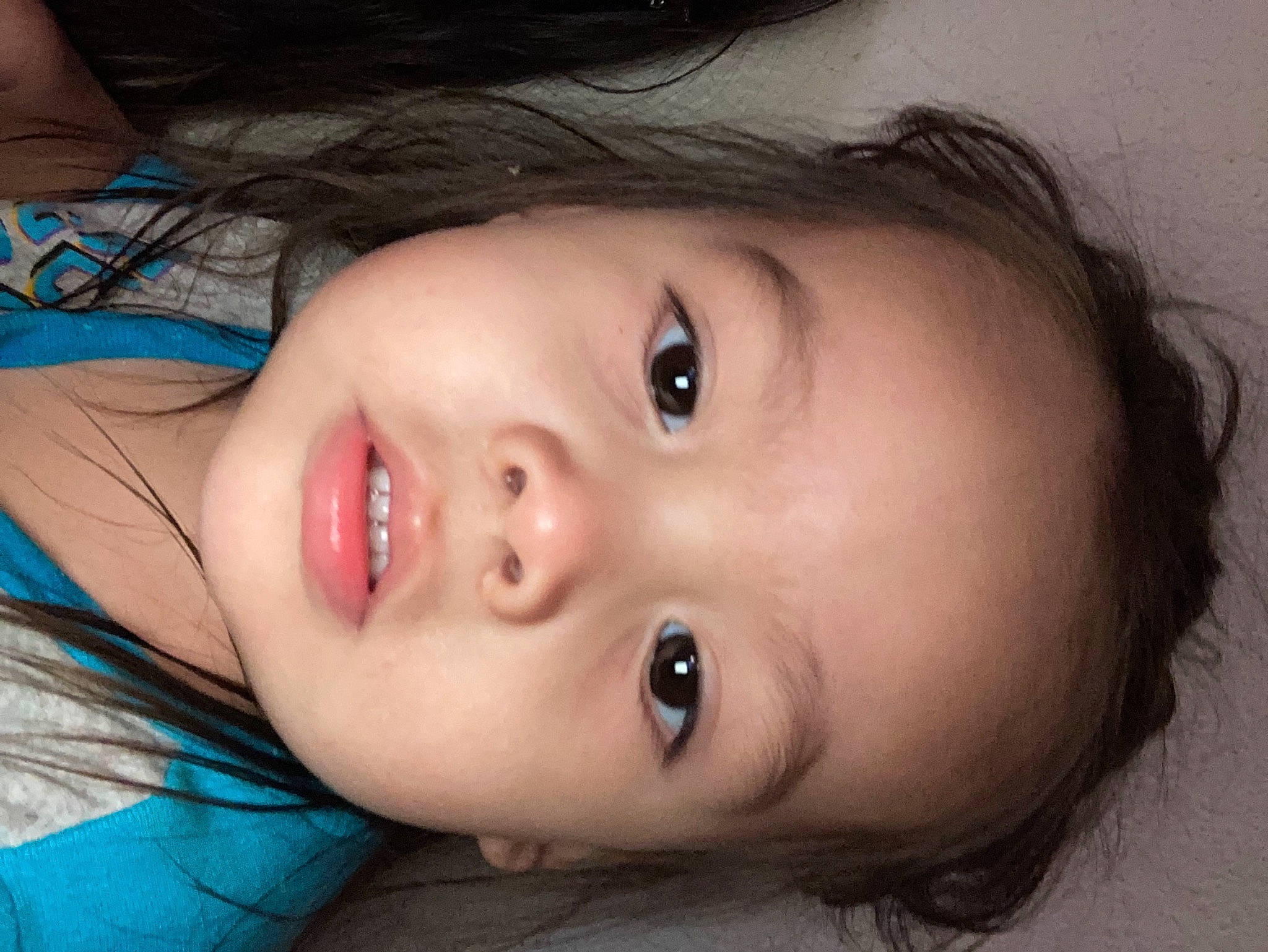 Julius is registered to the contest to win money with this photo: black_hair, cheek, chin, dress, ear, eyebrow, eyelash, flash_photography, forehead, human_body, iris, jaw, lip, mouth, neck, nose, person, plant, skin, smile