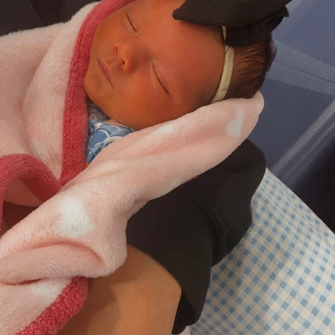 Oaklynn is registered to the contest to win money with this photo: baby, blanket, bow, closeup, clothing, comfort, cuddle, hand, headband, indoor, infant, newborn, peaceful, person, portrait, resting, skin, sleeping, soft, wrapped