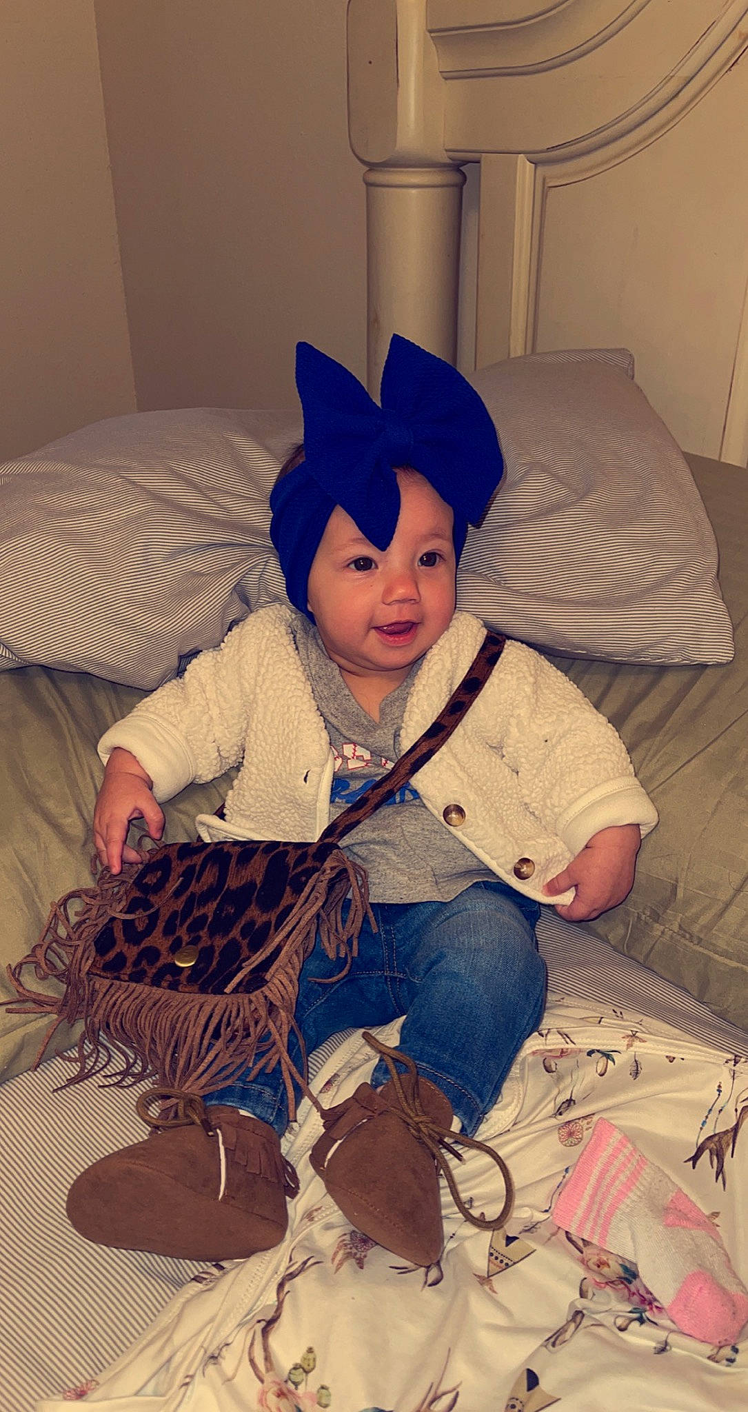 Nataleigh is registered to the contest to win money with this photo: baby, baby_toddler_clothing, bed, bed_sheet, bedding, bedroom, boot, comfort, costume, costume_accessory, costume_hat, denim, eye, headwear, home_accessories, lamp, linens, overall, person, pillow