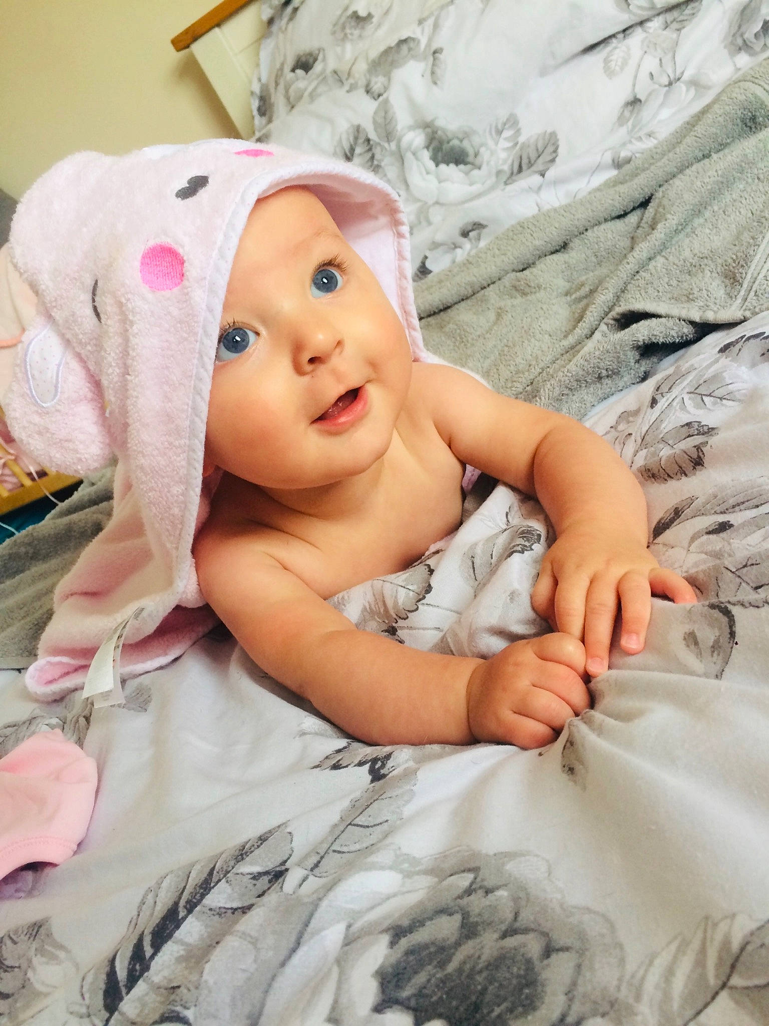 Lillie-rose is registered to the contest to win money with this photo: baby, cheek, child, eye, hair_accessory, headgear, linens, person, pink, product, skin, smile, textile, toddler