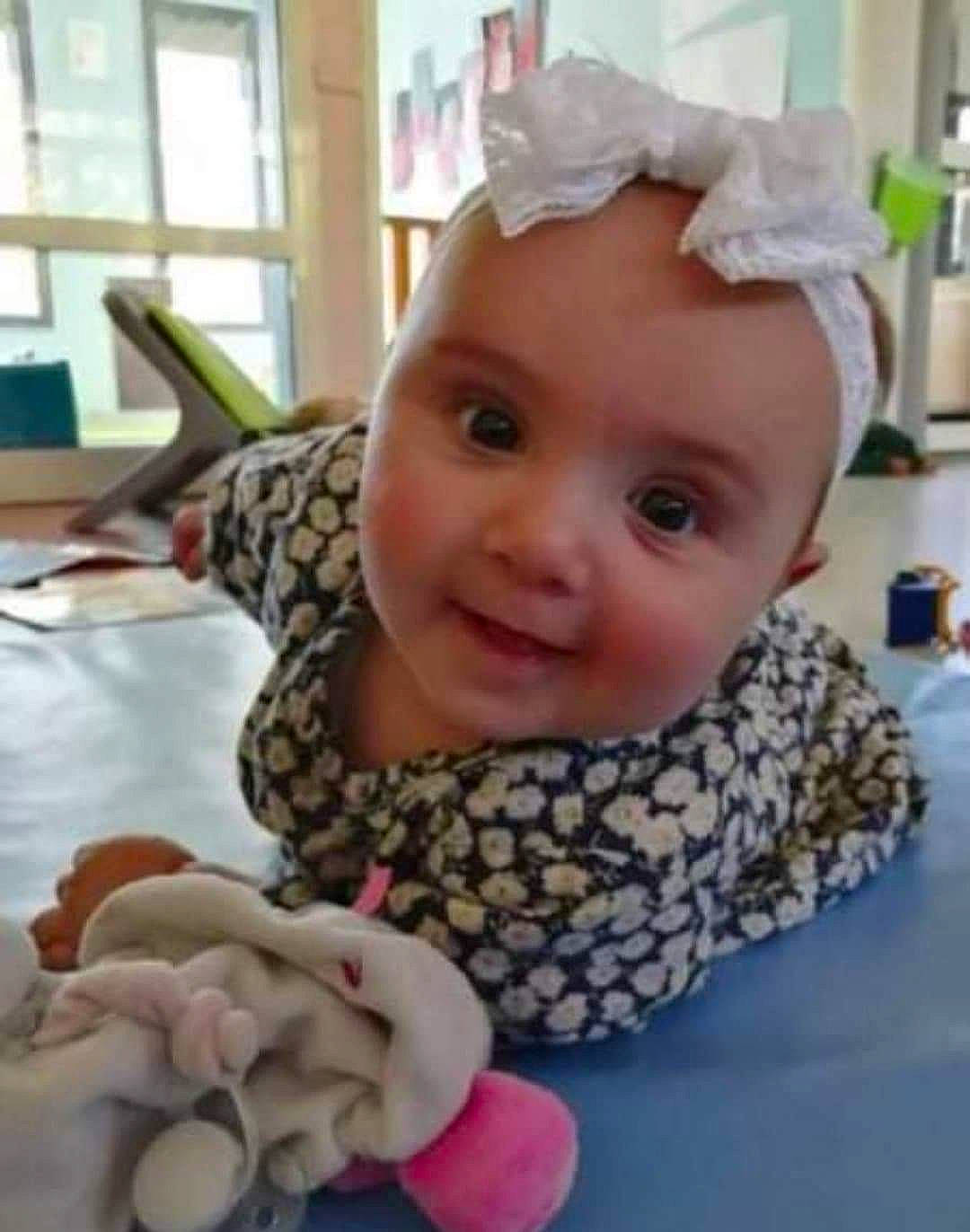 Elenitza participe au concours pour gagner de l'argent avec cette photo : baby, baby_products, baby_toddler_clothing, cheek, child, chin, fashion_accessory, fun, happy, headgear, headwear, iris, person, pink, product, room, skin, sleeve, smile, textile