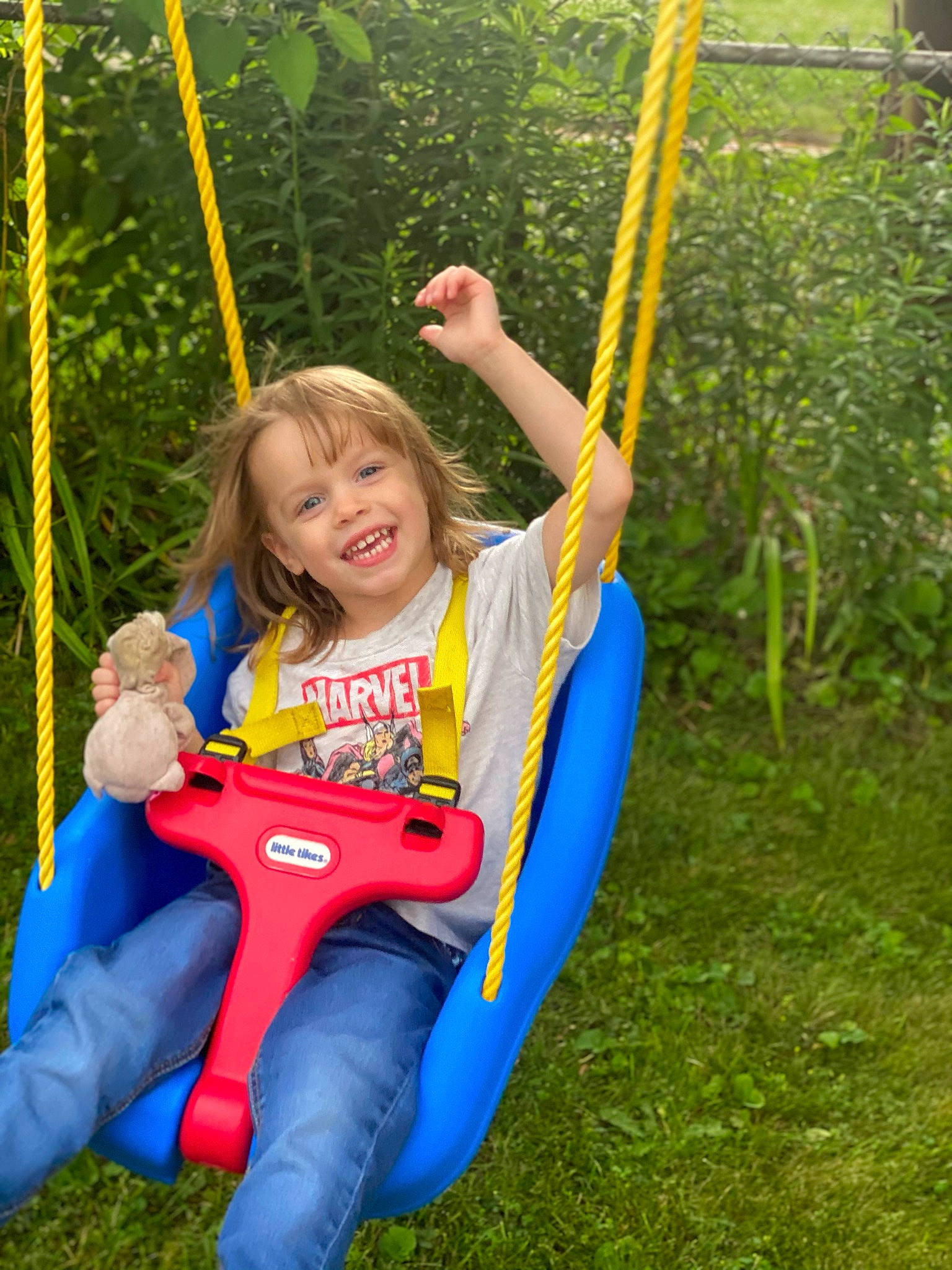 Alanah is registered to the contest to win money with this photo: facial_expression, fun, grass, hand, happy, joy, leisure, natural_environment, nature, outdoor_play_equipment, outdoor_recreation, people_in_nature, person, photograph, plant, public_space, recreation, smile, summer, swing
