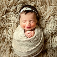 Ariella joined the competition — help win amazing prizes! baby, beanie, blanket, bonnet, cap, clothing, face, happy, hat, head, hood, knitwear, newborn, person, photography, portrait, sleeping, smile, sweater, wool