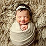 baby, beanie, blanket, bonnet, cap, clothing, face, happy, hat, head, hood, knitwear, newborn, person, photography, portrait, sleeping, smile, sweater, wool