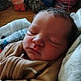 Izayah is registered to the contest to win money with this photo: baby, newborn, sleeping, face, blanket, clothing, indoor, infant, person, rest, cozy, soft, bedtime, cute, peaceful, child, portrait, warm, head, toddler
