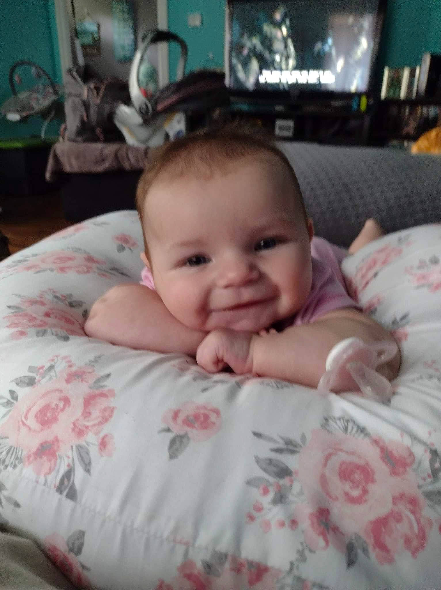 Evelynn is registered to the contest to win money with this photo: baby, baby_toddler_clothing, cheek, chin, comfort, eye, face, finger, fun, happy, iris, joy, linens, mammal, mouth, nose, person, room, skin, smile