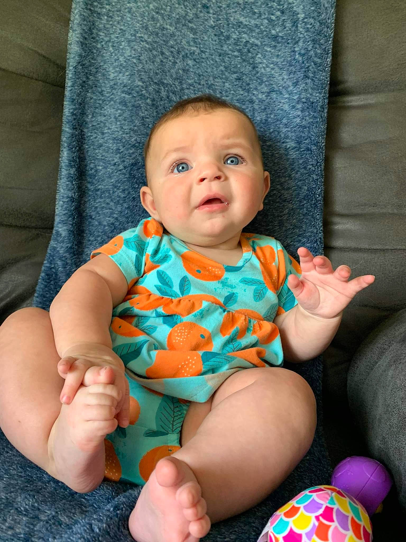 Evelynn joined the competition — help win amazing prizes! baby, baby_toddler_clothing, ball, chair, cheek, child, comfort, face, finger, iris, lap, leg, mouth, nail, person, pink, skin, sleeve, textile, thigh
