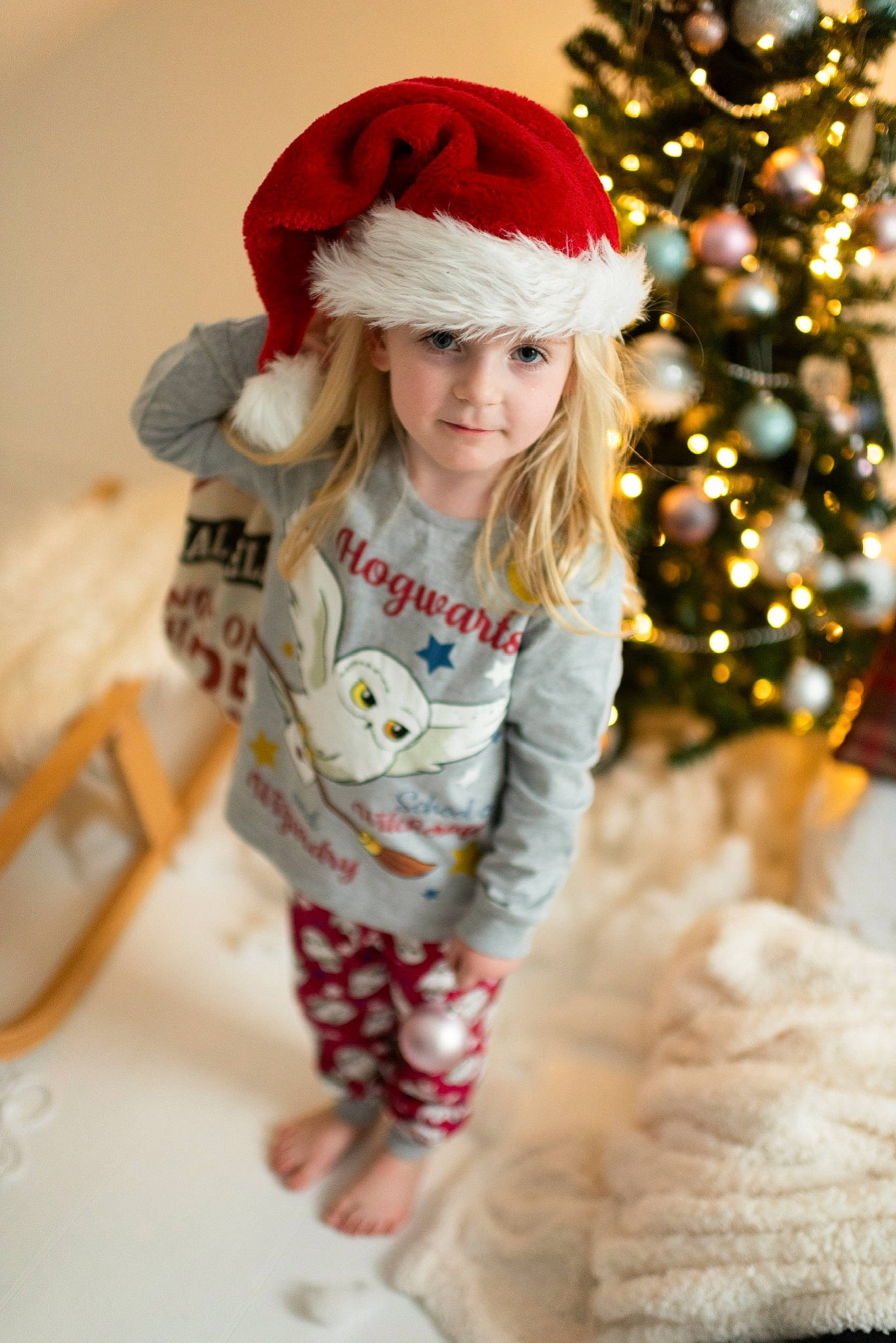 Louise joined the competition — help win amazing prizes! child, child_model, christmas, christmas_eve, christmas_tree, fictional_character, fur, happy, headgear, headwear, holiday, outerwear, person, santa_claus, toddler, tree, winter