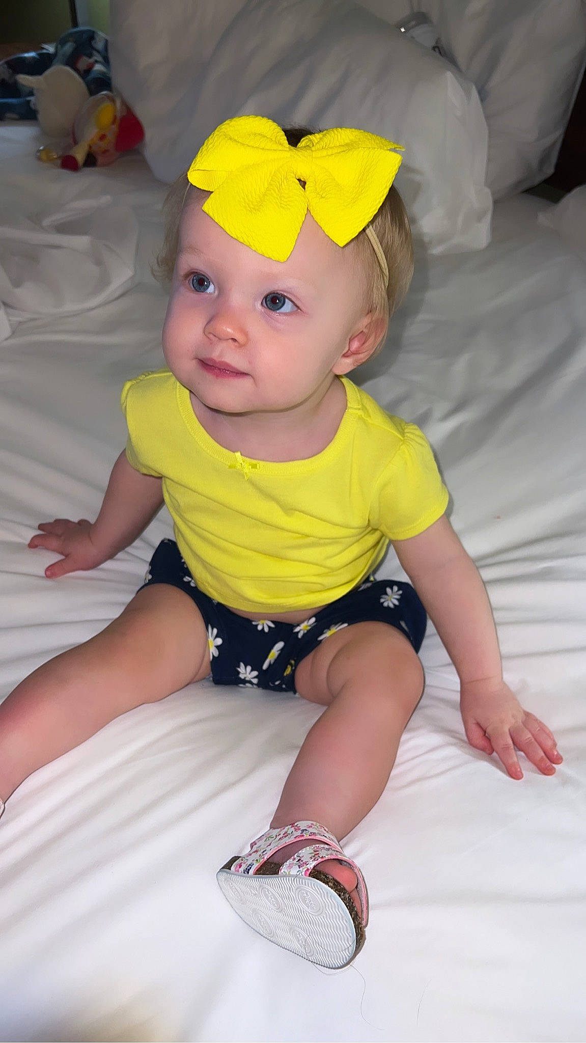 Daenerys is registered to the contest to win money with this photo: baby, baby_toddler_clothing, beauty, cap, cheek, chin, comfort, finger, happy, head, headwear, human_body, iris, pattern, person, pink, skin, sleeve, smile, toddler