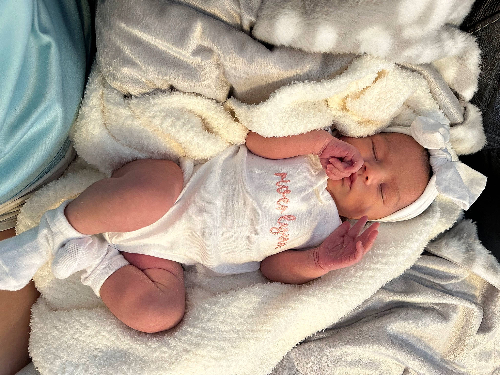 River is registered to the contest to win money with this photo: baby, baby_products, baby_sleeping, baby_toddler_clothing, cheek, child, comfort, eye, finger, gesture, hand, human_body, leg, linens, mouth, nail, person, skin, sleeve, thumb
