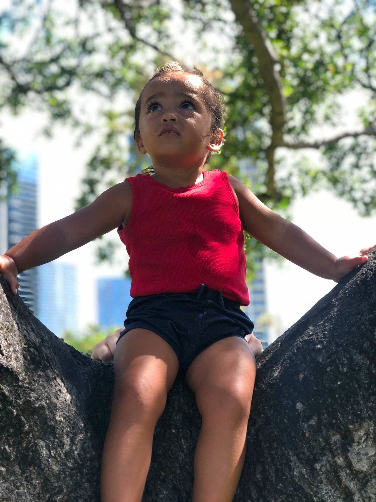 Sophia-rose joined the competition — help win amazing prizes! facial_expression, fun, grass, hairstyle, happy, human_body, leg, leisure, people_in_nature, person, public_space, recreation, shorts, shoulder, skin, standing, t_shirt, thigh, toddler, tree