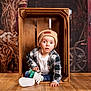 Soan a rejoint le concours — aidez-le/la à gagner de superbes lots ! autumn, baby, barn_door, beanie, casual_clothing, child, curious, cute, dried_plants, indoor, jeans, plaid_shirt, portrait, rustic, sitting, toddler, white_shoes, wide_eyes, wood_floor, wooden_crate