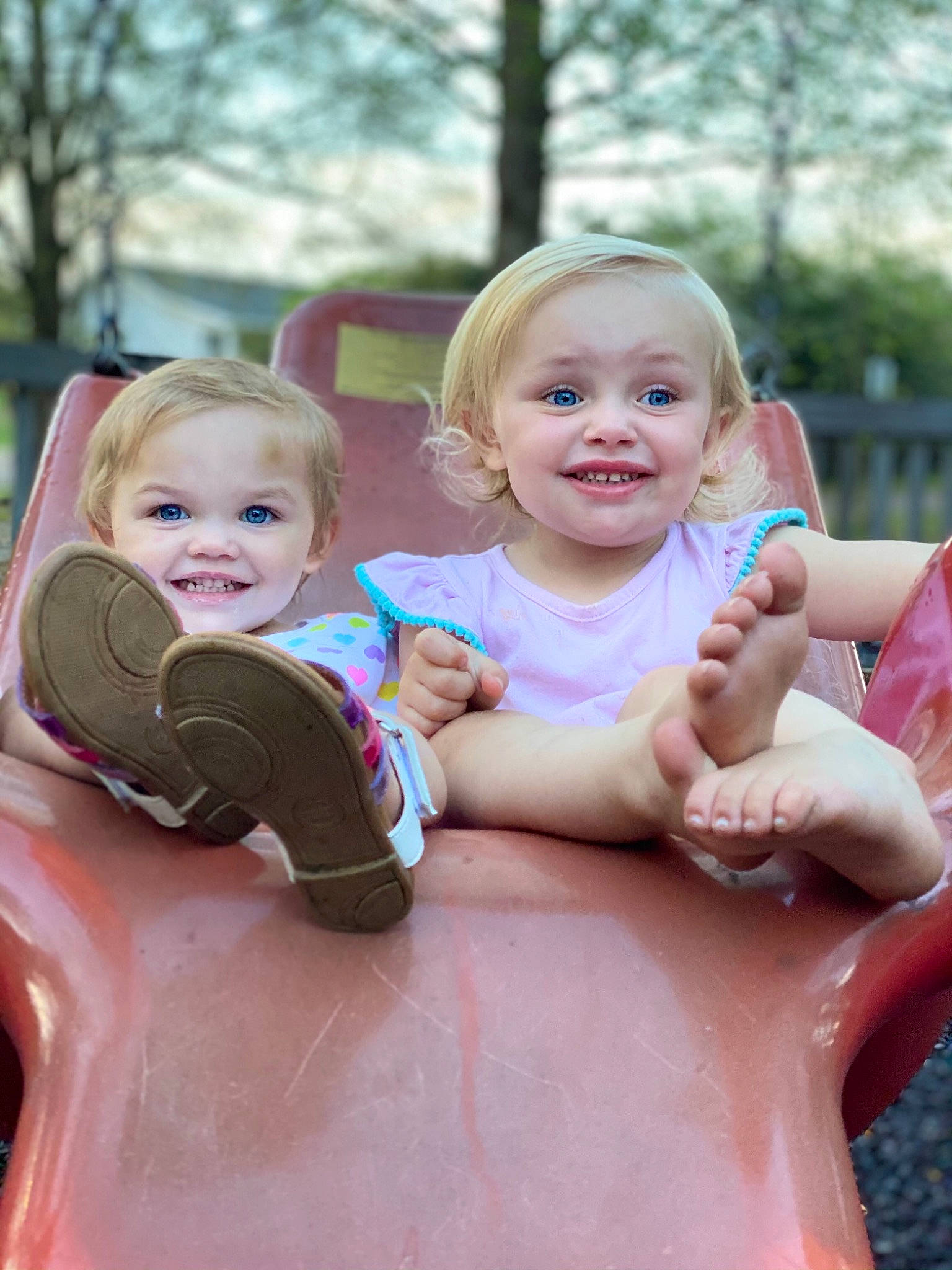 Brittlynn is registered to the contest to win money with this photo: arm, baby, baby_toddler_clothing, cheek, face, fun, gesture, grass, hairstyle, hand, happy, joy, leisure, mammal, person, pink, playground, recreation, skin, smile