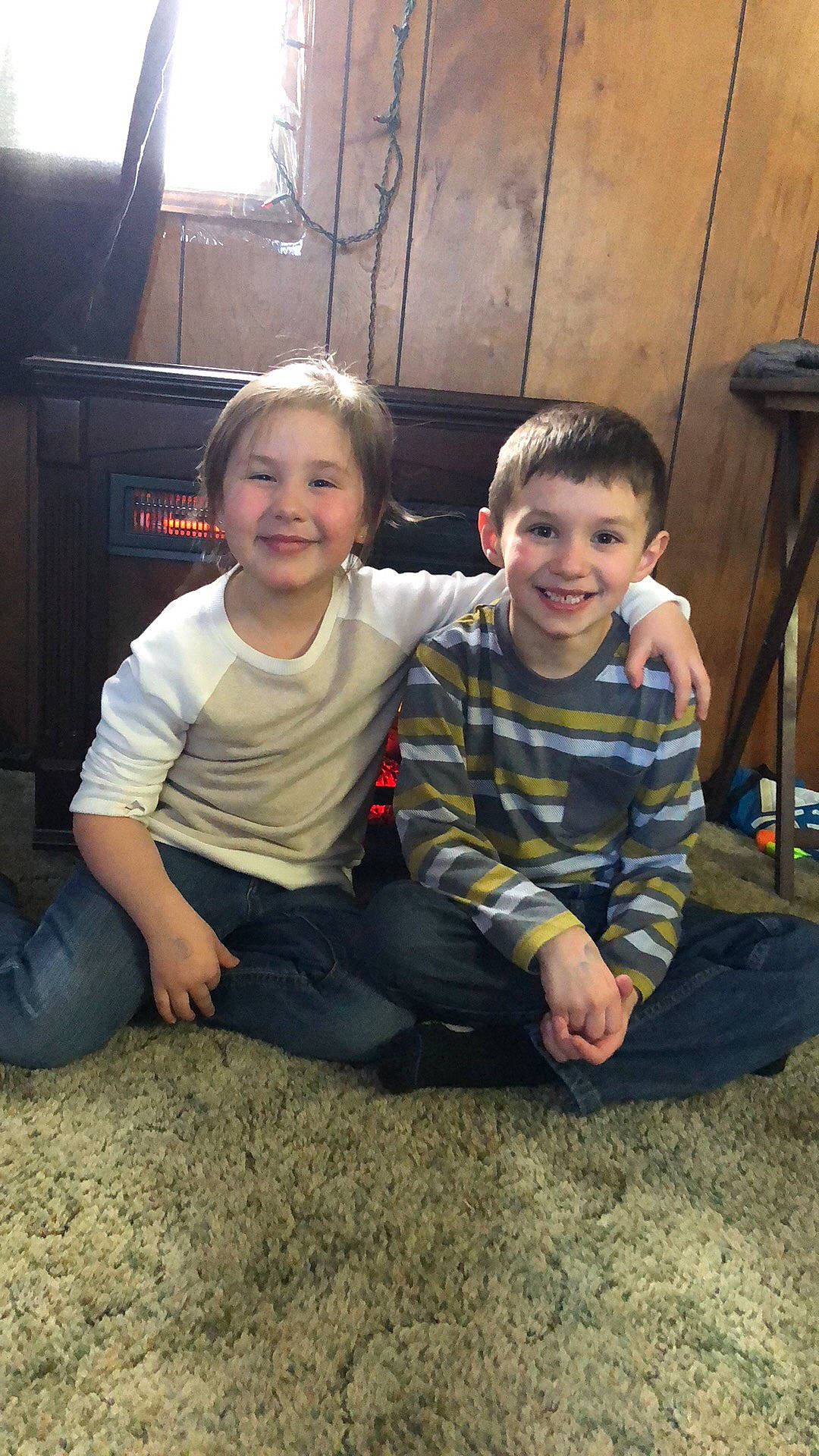 Kaydalence is registered to the contest to win money with this photo: child, cousin, event, facial_expression, flooring, fun, grass, hairstyle, happy, head, joy, lap, leisure, person, sibling, sitting, smile, soil, standing, t_shirt