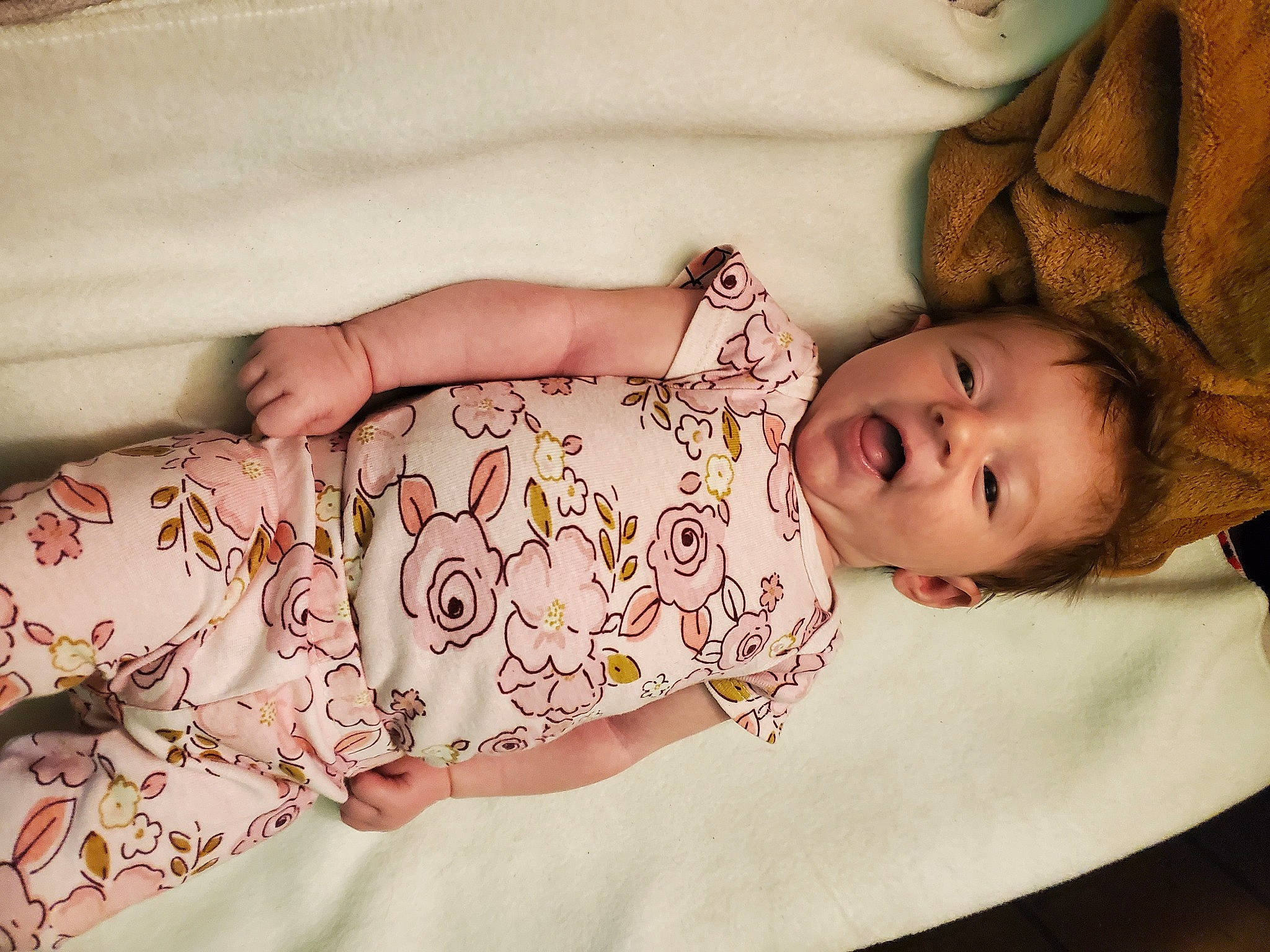 Austin is registered to the contest to win money with this photo: arm, baby, baby_toddler_clothing, cheek, child, comfort, dress, eye, eyelash, face, hand, head, headgear, human_body, lip, person, pink, skin, sleeve, textile