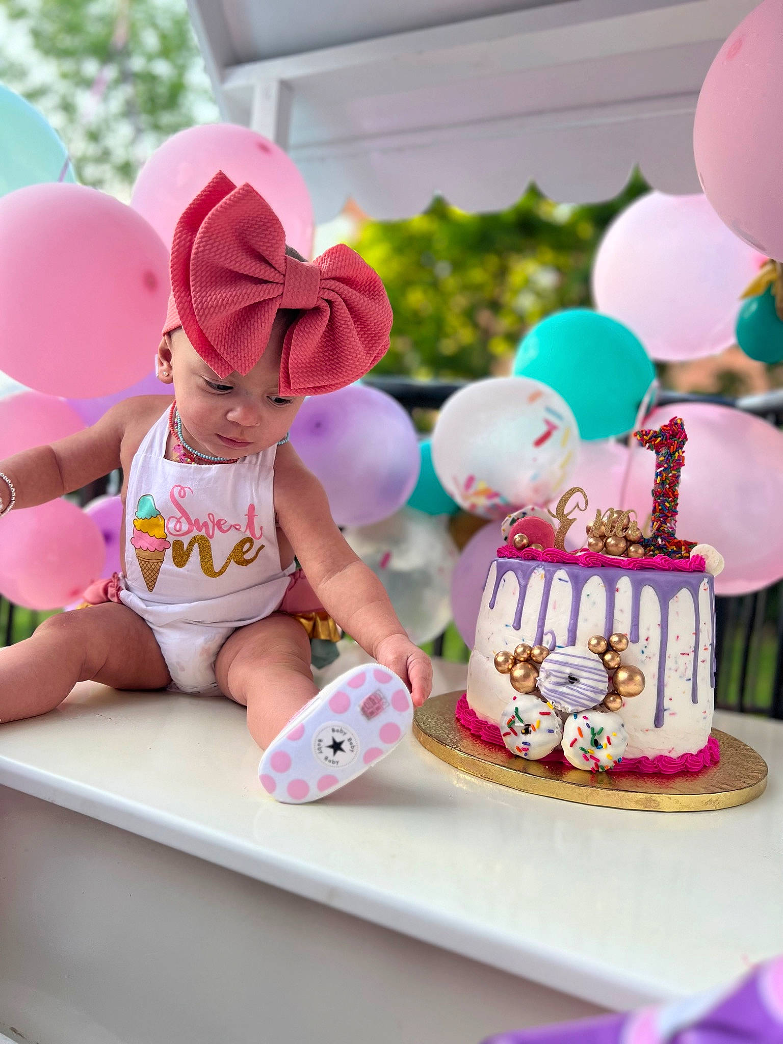 Thianelys Enaï joined the competition — help win amazing prizes! baby, baby_toddler_clothing, balloon, cap, cup, drinkware, event, food, happy, hat, headgear, headwear, leisure, magenta, person, pink, purple, recreation, serveware, shorts