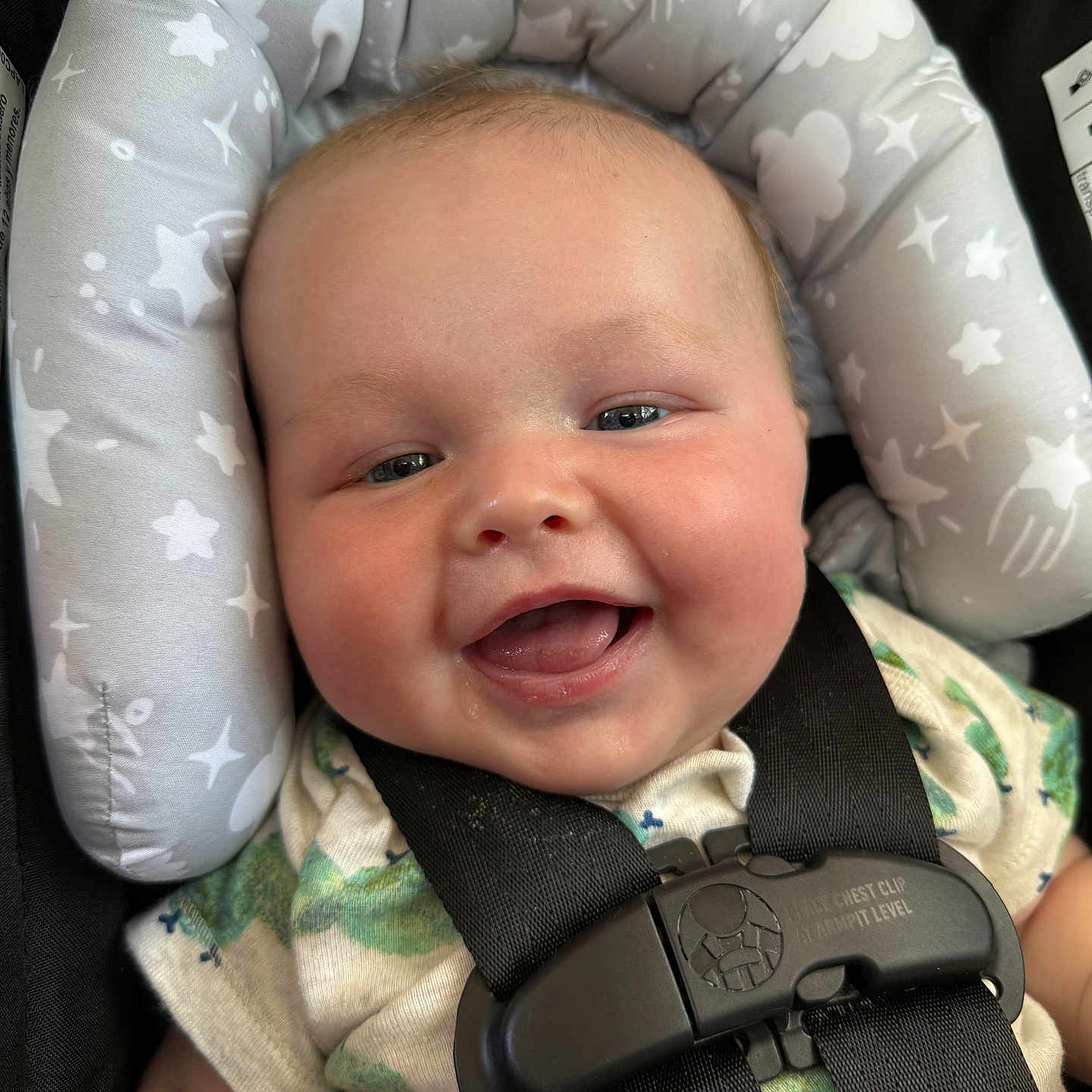 Oliver is registered to the contest to win money with this photo: accessories, baby, babylaughing, belt, car, clothing, cushion, e_scooter, face, happy, hat, head, homedecor, person, photography, portrait, strap, transportation, vehicle, vest