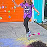 child, girl, purple_shirt, minecraft, toy, play, garage_door, easter_eggs, outdoor, sidewalk, chalk, colorful, happy, action, hair, curly_hair, footwear, building, door, green_vehicle