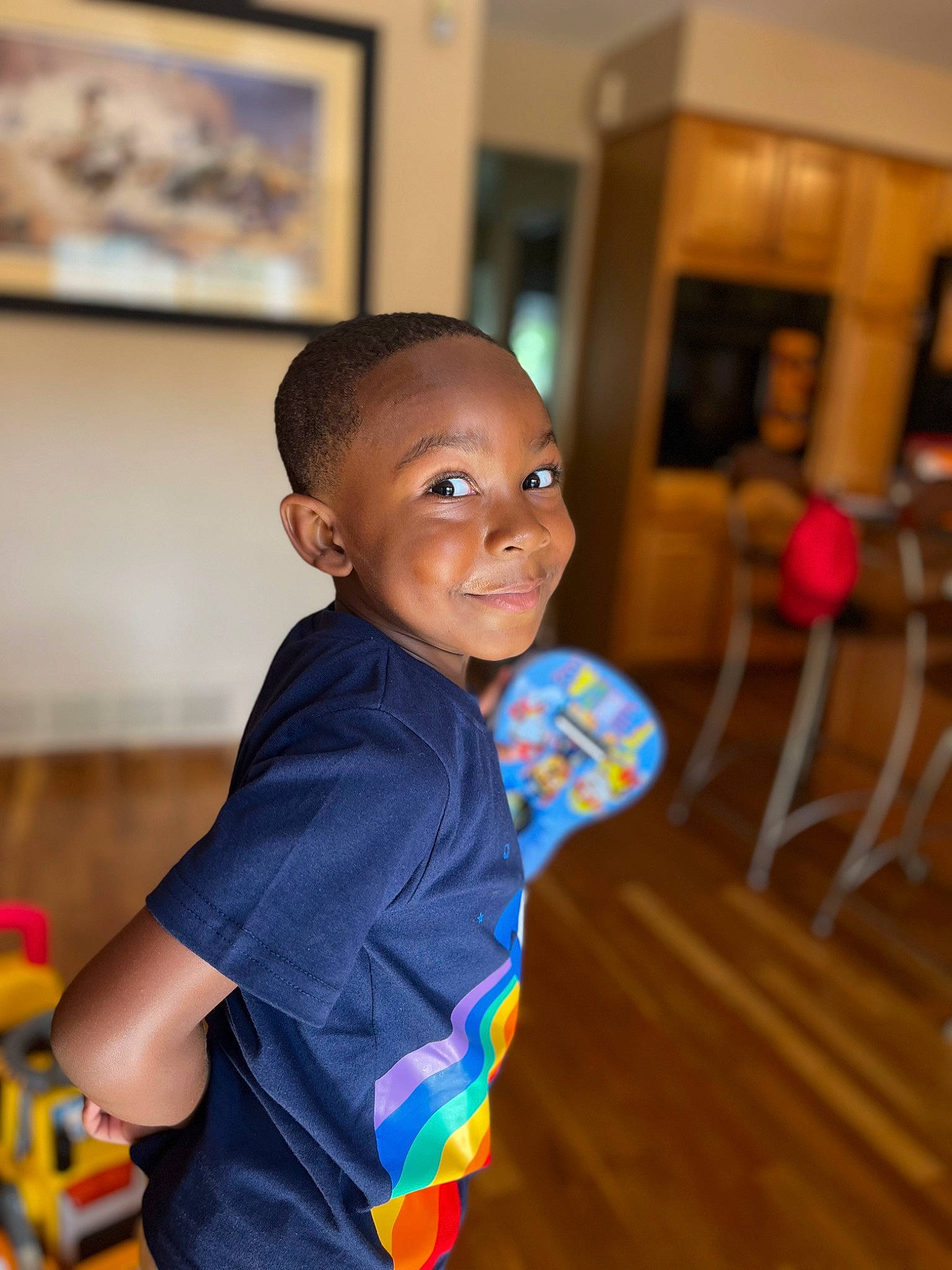 Jabari joined the competition — help win amazing prizes! chair, child, event, floor, flooring, fun, happy, hardwood, house, joy, leisure, person, picture_frame, play, sitting, smile, standing, t_shirt, toddler, varnish