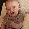 Krue is registered to the contest to win money with this photo: baby, infant, smile, happy, face, person, cushion, clothing, onesie, skin, head, arm, indoor, seat, cute, expression, child, young, portrait, comfortable