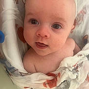 Krue is registered to the contest to win money with this photo: baby, infant, face, eyes, blanket, skin, expression, cute, young, child, portrait, head, looking_up, soft, wrapped, indoors, person, newborn, closeup, human