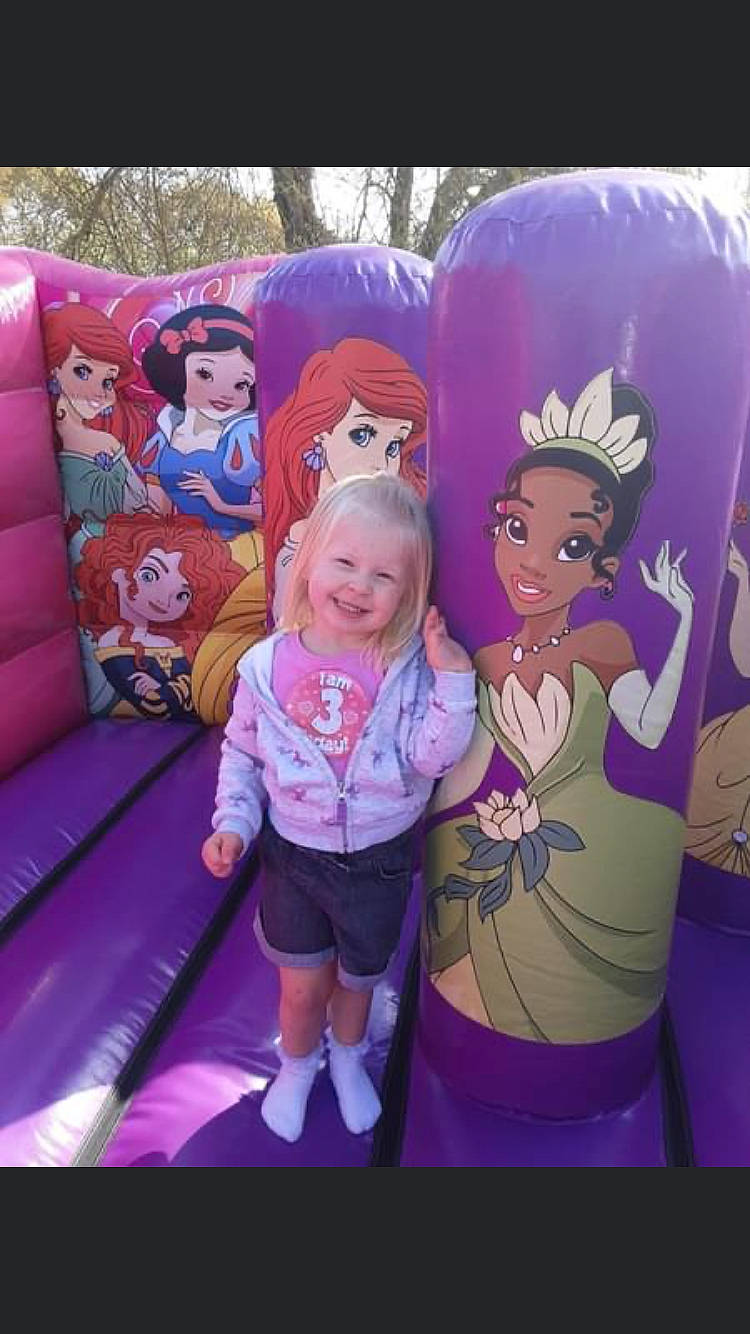 India-rose is registered to the contest to win money with this photo: art, child, event, fictional_character, fun, happy, illustration, inflatable, joy, leisure, magenta, person, pink, purple, recreation, room, shorts, smile, t_shirt, toddler